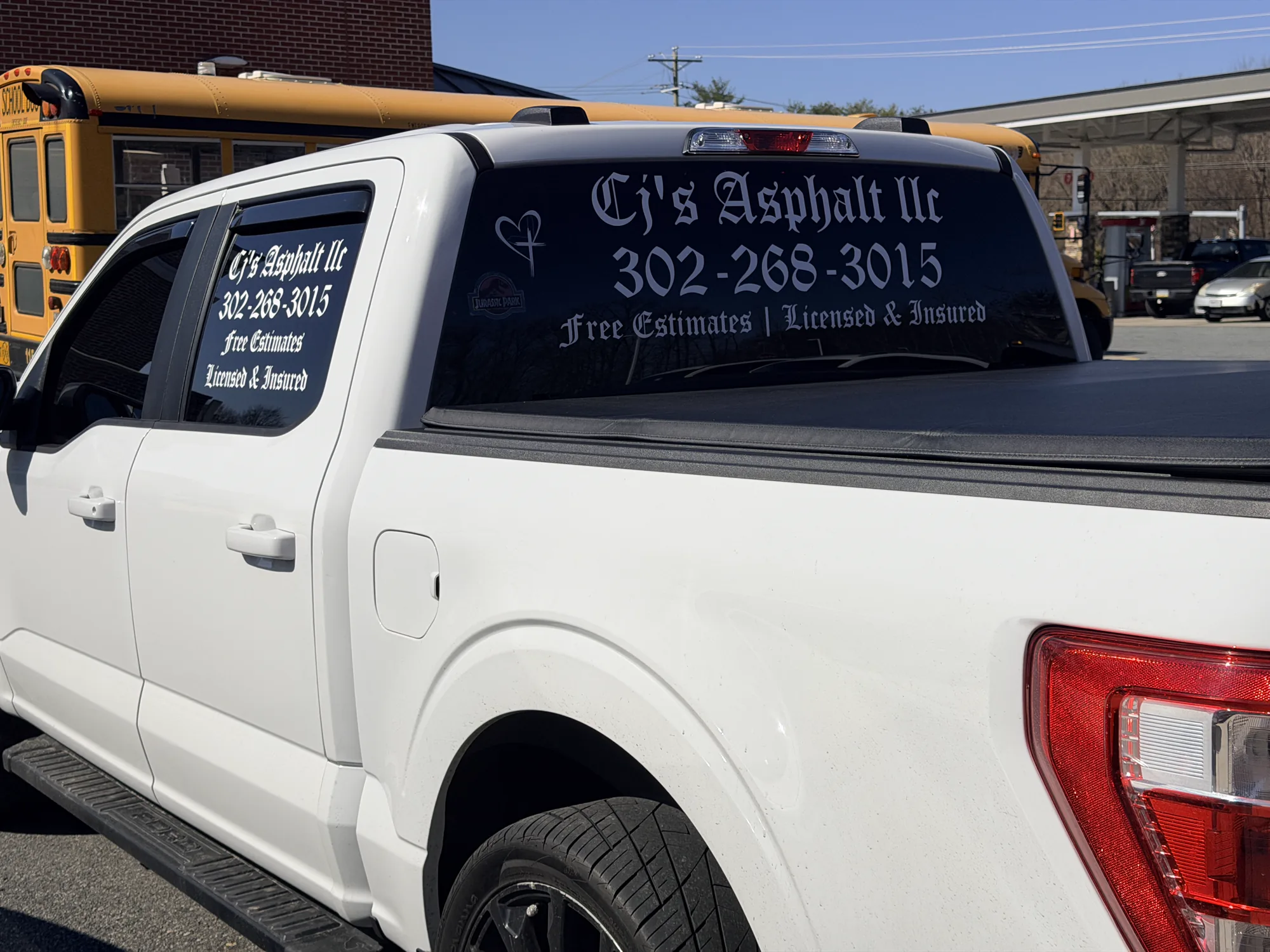 Perforated rear-window and side-window decals for CJ's Asphalt in Delaware — visibility from outside, clear view from the driver's seat