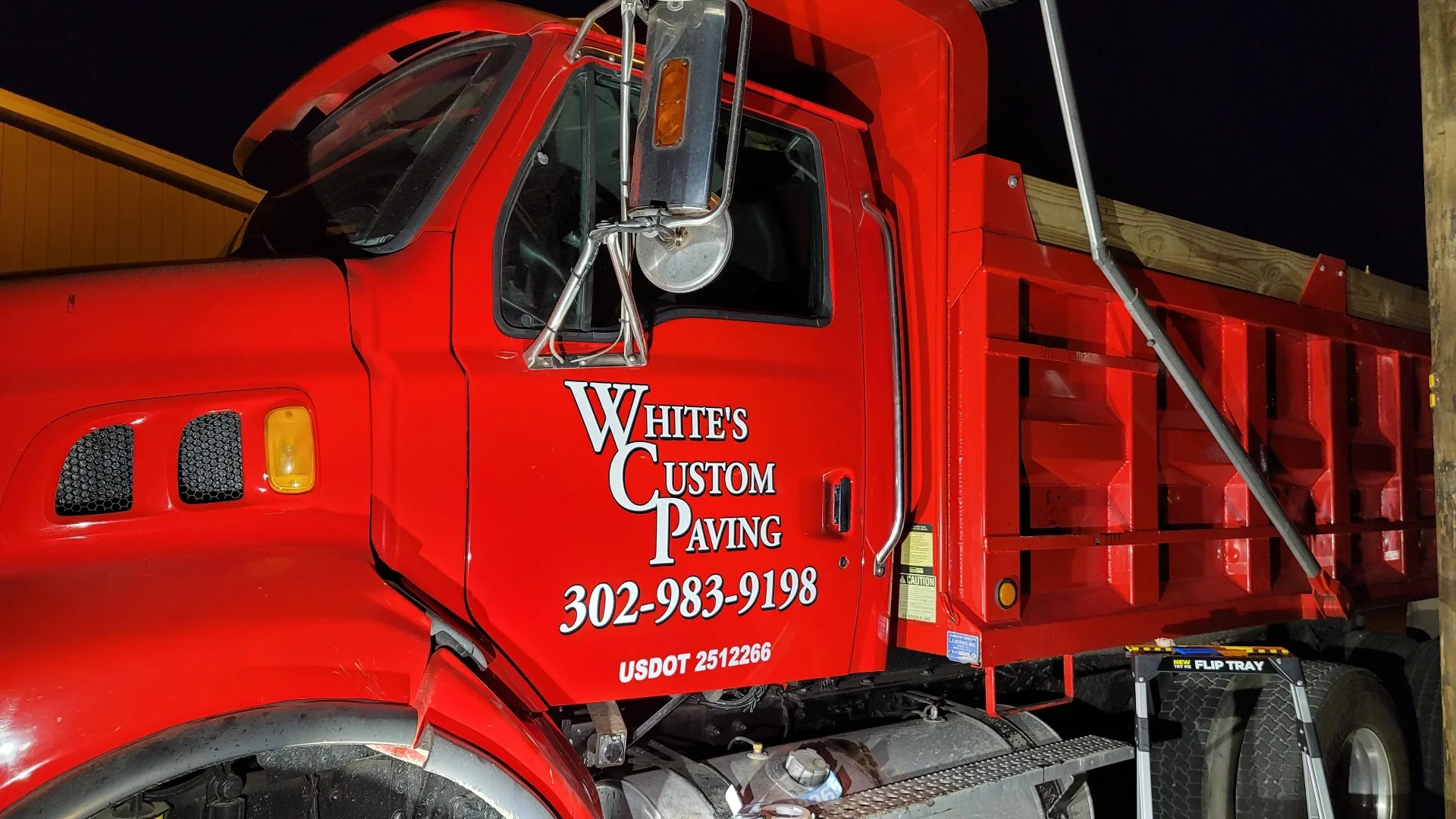 Dump truck lettering for Whites Paving fleet in Delaware